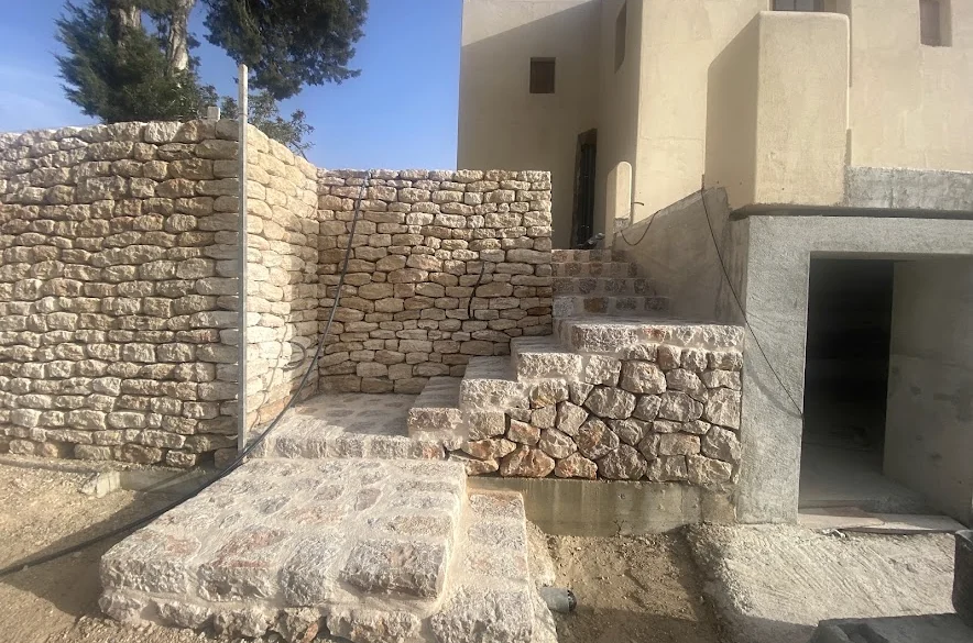 Stone staircase and walls during construction